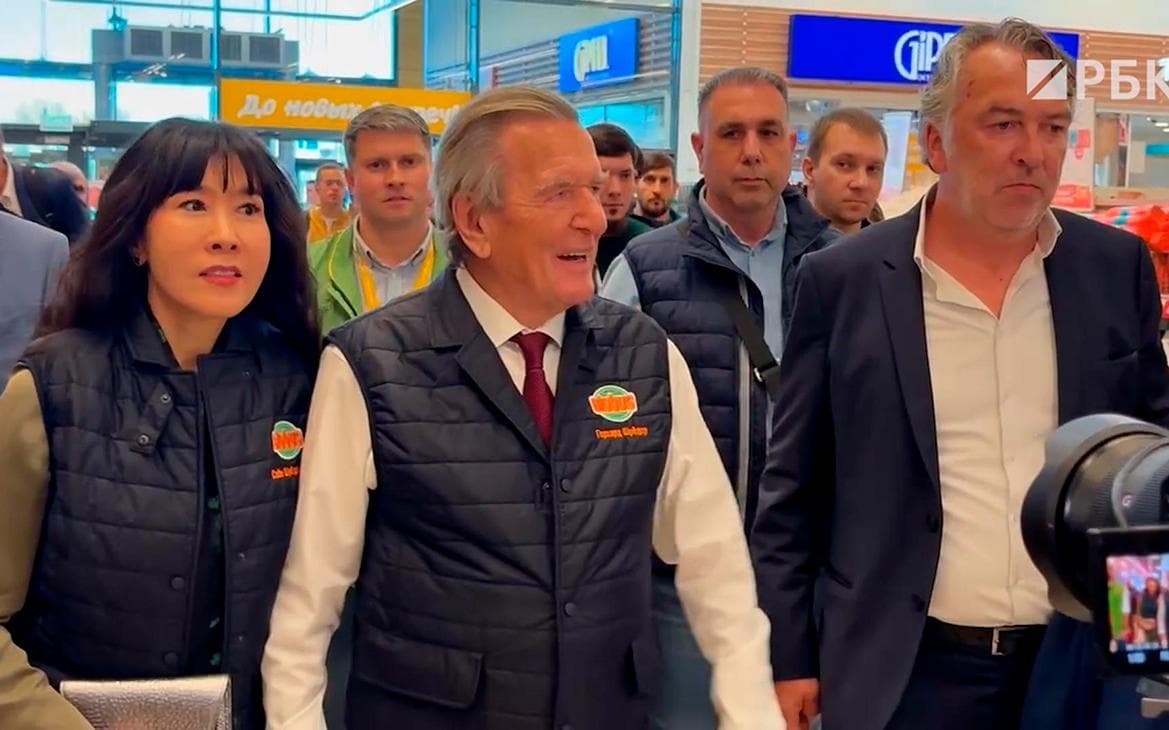 The cameraman broke the champagne while Schroeder was walking around the Globus. Video