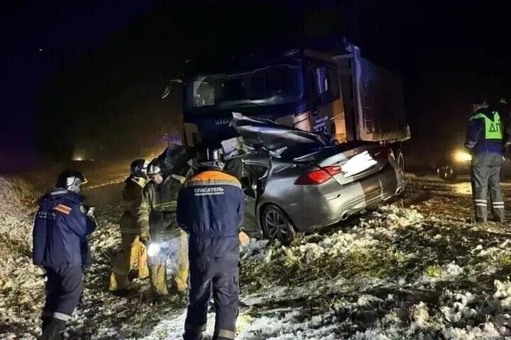 Two people died in a collision between a car and a truck