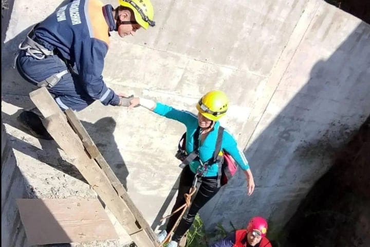In Sochi, rescuers pulled a woman and a dog from a pit at a construction site