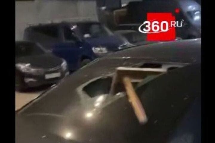 The teenager punched a stool glass of a foreign car
