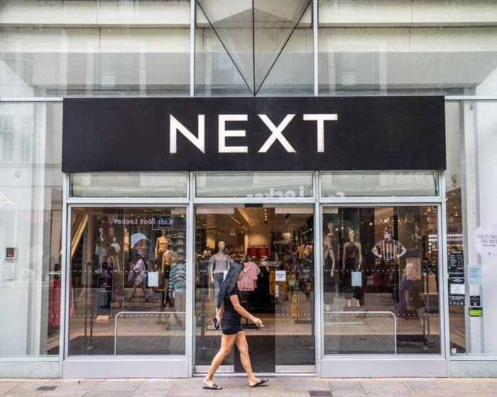 Next forecasts bigger profits after hot weather lifts sales